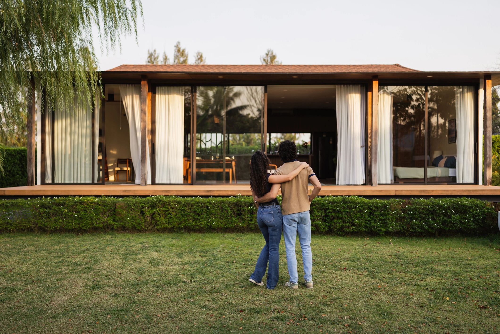 Homeowners admiring their new home